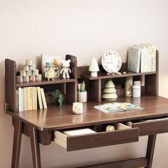 a wooden desk with books and toys on it