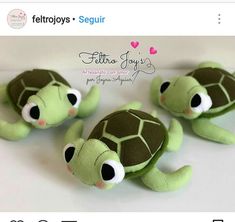 there are three stuffed animals that look like they're baby sea turtles, one is green and the other is brown