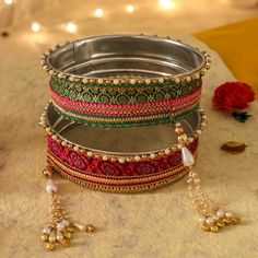 A specially curated Chalni for the auspicious celebration of Karwa Chauth, this Chalni is handmade with pure rawsilk fabric with golden & pearl colored beads that look absolutely elegant. Standard Chalni - 6.5 inches in diameter Gift this Pooja thali along with chalni for your wife who would be keeping a fast for you on the festive occasion of Karwa Chauth Karva Chauth Chalni Decoration, Saree Outfit, Silk Bangles, Thali Decoration, Birthday Flowers Bouquet, Pooja Thali, Karva Chauth, Raw Silk Fabric, Festivals Of India