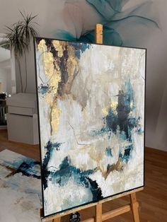 an easel with a painting on top of it