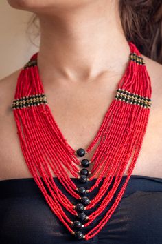 "Beautifull red layered necklace that is a true eye catcher. These nepalese traditional craftmanship necklaces (Mala) are made with a modern touch. A \"pote\" is a traditional nepali necklace made by stringing small cut (glass) beads. This necklace is designed in a trending long style and is durable and skin friendly." Fair Trade Red Jewelry For Festivals, Red Fair Trade Jewelry For Festivals, Fair Trade Jewelry For Festivals, Festive Fair Trade Jewelry For Festivals, Red Fair Trade Jewelry With Round Beads, Red Fair Trade Necklace As Gift, Traditional Fair Trade Jewelry For Festivals, Traditional Multi-strand Beaded Necklaces For Festivals, Traditional Multi-strand Beaded Necklaces For Festive Occasions