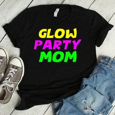 Glow Party Mom Shirt | glow party mom, glow party, glow in the dark, glow party shirt, birthday shirt, birthday party, neon party We print on everything! In our shop you will find our designs mostly on short sleeve shirts, but since we use Printful's printing services we can print any design on any type of shirt or item you can see here: https://www.printful.com/custom-products You are welcome to send us a message if you want a design printed on any of the items on the Printful website. Glow Par Fun T-shirt With Funny Text For Parties, Fun Black Party Tops, Fun Black Party T-shirt, Fun Black T-shirt For Party, Black Fun T-shirt For Casual Party, Fun Party T-shirt With Text Print, Fun Party T-shirt With Funny Print, Fun T-shirt With Funny Print For Party, Birthday Party Neon