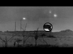 an image of the desert with trees and lights in the sky, taken through a round lens