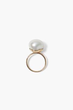 Designer Chan Luu creates homeware and jewelry that unites her passion for artisan-made crafts with a reverence for organic forms found in nature. The 14k Monaco Ring White Pearl is a luminous freshwater pearl held within 14k solid gold. This piece's bold silhouette can be worn on its own or paired with subtle gold rings. An elegant statement that radiates timelessness. Product Details 14k yellow gold. Freshwater pearls are one of a kind so size and shape may vary. Care Instructions Refrain from Handmade Box, Organic Form, Vintage Fabrics, White Ring, White Pearl, Statement Ring, Pearl White, Monaco, Fresh Water