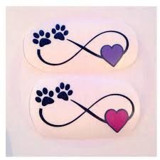 two stickers with hearts and paw prints on them