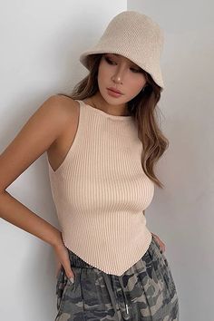 Beige Fitted Sleeveless Crop Top, Fitted Sleeveless Beige Crop Top, Trendy Fitted Beige Tank Top, Trendy Beige Tank Vest, Beige Stretch Vest Crop Top, Trendy Beige Vest Crop Top, Beige Stretch Vest Top, Trendy Ribbed Summer Vest, Chic Beige Sleeveless Crop Top