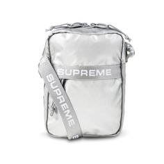 Price Is Firm. 100% Authentic Brand New Supreme Bag In Plastic Bag Supreme Logo-Print Metallic Shoulder Bag Boasting A Metallic Silver Colourway, This Aw22 Bag Is Defined By Its Logoed Webbing Shoulder Strap. Constructed From Water-Resistant Fabric, This Compact Accessory Provides Storage Space With Its Front Zip Compartment And Internal Mesh Pocket. Highlights Silver-Tone Rectangle Body Metallic Finish Logo-Print Strap Front Zip-Fastening Compartment Two-Way Zip Fastening Adjustable Shoulder St Highlights Silver, Burberry Fashion, Supreme Backpack, Supreme Logo, Supreme Bag, Red Camo, Side Bags, Messenger Bag Men, Black Shoulder Bag