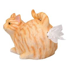 an orange and white cat figurine with a tissue dispenser on its back