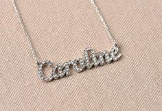 This Cubic Zirconia name necklace is producible 14k Solid GOLD ( not filled or plated) or 925 Sterling Silver.  Gold Cubic Zirconia Necklace in 14k Gold, Rose Gold, White Gold.  #personalizednecklace #VivaRing #14kgoldnecklace #personalizedchoker #customnecklace #PersonalizedJewelry #personalizedgift #namenecklace #initialnecklace  #lovegifts #personalizedpendant #birthdaygiftromantic #romanticgifts #giftsforbestfriend Silver Cubic Zirconia Pendant Name Necklace, Silver Cubic Zirconia Pendant Necklace, Silver Cubic Zirconia Nameplate Necklace, Classic Personalized Cubic Zirconia Necklaces, Classic Personalized Cubic Zirconia Necklace, Silver Name Necklace With Diamond Accents For Wedding, Personalized Cubic Zirconia Pendant Name Necklace, Personalized Cubic Zirconia Pendant Necklace, Personalized Silver Diamond Necklace With Cubic Zirconia