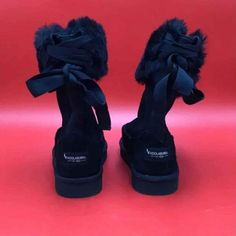 Excellent Condition Fur Shearling Bow Ribbon Black Boots With Faux Fur Trim For Cold Weather, Black Faux Fur Boots For Winter, Black Casual Boots With Faux Fur Trim, Black Boots With Faux Fur Trim And Round Toe, Winter Black Boots With Faux Fur Trim, Black Faux Fur Boots With Round Toe, Black Shearling Boots For Fall, Black Ankle Boots With Faux Fur Trim, Black Shearling Boots With Faux Fur Trim