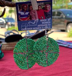 Handmade African beaded earrings created in a truly classic style. Historically beads have been a part of the Maasai tradition, passed down from generation to generation. These bright, beautiful circles make a great gift or a unique addition to your jewelry collection. Each beaded earring is an "original" work of art, individually handcrafted, no two are exactly alike which adds to their value and charm. The original nature of tribal art will be reflected by variances from the beaded earrings, e Traditional Handmade Green Hoop Earrings, Traditional Green Beaded Earrings For Festivals, Unique Handwoven Green Earrings, Traditional Green Handwoven Beaded Earrings, Green Artisan Round Bead Earrings, Green Hoop Earrings For Festivals And Gifts, Green Beaded Earrings With Large Beads For Gift, Artisan Green Handwoven Beaded Earrings, Artisan Adjustable Green Beaded Earrings