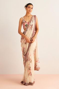 Off-white pre-draped saree with vintage floral placement print and embroidered border. Paired with sequin, bead embellished padded blouse.
Components: 2
Pattern: Printed, Embellished
Type Of Work: Vintage floral, bead, sequin
Neckline: U neck
Sleeve Type: Sleeveless
Fabric: Blouse: Viscose Silk, Saree: Viscose Georgette
Color: Off White
Other Details: 
Model height: 5 ft 9 inches, wearing size S
Length:
Blouse: 14 inches
Saree: 44 inches
Embroidered border
Back tassel tie-up
Note: Only off-white Off White Saree, Vintage Floral Blouse, Floral Saree, Floral Lace Blouse, White Saree, Drape Saree, Lehenga Saree, Silk Lehenga, Blouse For Women