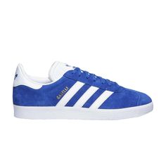 Find ADIDAS Gazelle 'royal on Editorialist. This adidas Gazelle boasts a pigskin leather upper with synthetic overlays across its construction. The Collegiate Royal colorway is contrasted by the tongue, heel panel and Three-Stripes, which appear in white. The signature color of this model also makes its way to the adidas Trefoil logos. Gold ‘Gazelle’ lettering appears on the midfoot, while the shoe sports a synthetic lining. Blue Gazelle, Adidas Trefoil, Pig Skin, Adidas Gazelle, Royal Blue, Leather Upper, Sport Shoes, Adidas, Sports