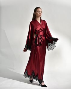 Irresistible in its classic cut, the silk kimono robe with lace embellishments exudes passion. Crafted from silk and satin blend, it features a dramatic, long sweeping hem and draped sleeves, creating a captivating silhouette reminiscent of old Hollywood glamour. The broad obi-style sash draws the waist for a polished profile, making it the epitome of sophistication and a luxurious start to every morning. ✓ garment length - 147 cm/58'' ✓ wrap over style ✓ two sets of inside ties ✓ wide obi-tie i Luxury Gown With Satin Finish, Luxury Wedding Gown With Satin Finish, Elegant Evening Robe, Floor-length, Elegant Evening Floor-length Robe, Elegant Floor-length Evening Robe, Fitted Satin Night Robe, Fitted Silk Wedding Robe, Luxury Silk Gown With Satin Finish, Elegant Fitted Night Gown