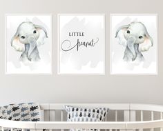 two pictures of an elephant on the wall above a crib in a baby's room