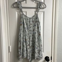 Floral Printed Romper With Pockets. Straps Are Adjustable. It’s In Excellent Condition. Pre-Owned, But Was Never Worn. Casual Sleeveless Jumpsuits And Rompers For Brunch, Sleeveless Casual Jumpsuits And Rompers For Brunch, Casual Blue Jumpsuits And Rompers For Daywear, Sleeveless Cotton Jumpsuits And Rompers By Urban Outfitters, Urban Outfitters Sleeveless Cotton Jumpsuit And Romper, Sleeveless Cotton Jumpsuits From Urban Outfitters, Light Blue Sleeveless Jumpsuits And Rompers For Day Out, Casual Floral Print Jumpsuits And Rompers For Brunch, Blue Jumpsuits And Rompers For Spring Daywear