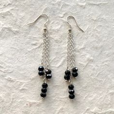 Lightweight Black Spinel These earring are so fun to wear. There is a slight "retro" look to them. That's why I love them. These earrings are definitely casual or dressy. Diy Black Earrings, Trendy Black Nickel-free Earrings, Trendy Adjustable Earrings For Evening, Black Beaded Metal Dangle Earrings, Trendy Black Beaded Earrings For Gift, Nickel-free Black Beaded Drop Earrings, Black Dangle Earrings With Ear Wire, Black Dangle Earrings With Black Beads, Black Dangle Linear Earrings For Pierced Ears