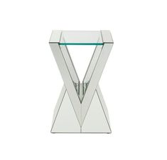 a glass and metal table with an x design on the top, against a white background