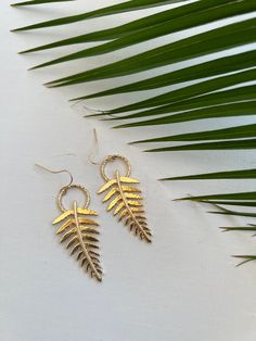 The fern is symbolic of everlasting youth. Many people believe that the fern represents new life and new beginnings. Handmade with Aloha. 14k gold plated. Hammered finish Gold Leaf Nature-inspired Jewelry, Nature-inspired Gold Leaf-shaped Jewelry, Nature-inspired Gold Leaf Earrings, Gold Leaf-shaped Nature-inspired Earrings, Gold Leaf Nature-inspired Earrings, Nature-inspired Gold Leaf-shaped Earrings, Nature-inspired Gold Earrings For Everyday, Nature-inspired Nickel-free Gold Earrings, Gold Nature-inspired Earrings For Everyday