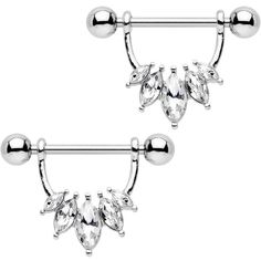 two pairs of surgical piercings with crystal stones on each end and an attached bar