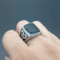 This ring is with care and perfection. It is made of pure Stainless Steel and to enhance the beauty even more it has black stone in the middle with a knot design on the sides. This is inspired by a Nordic and Viking theme and is a very good and high quality statement piece. Black Polished Finish Promise Ring, Elegant Black Stainless Steel Rings, Black Stainless Steel Ring With Polished Finish, Elegant Black Stainless Steel Signet Ring, Black Stainless Steel Signet Promise Ring, Black Stainless Steel Open Ring, Black Stainless Steel Rings For Gift, Black Stainless Steel Ring Jewelry, Black Stainless Steel Open Ring Jewelry