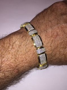 "This listing is for a stunning iced out solid 925 Sterling silver bracelet that comes in 2 finishes: rhodium (white) or 14k yellow gold finish. Bracelet is adorned with 12 carats of man-made diamond, making it super icy! Weight is approximately 31 grams and thickness is 12.5mm wide. 8.5\" length FREE SHIPPING IN THE US!!" Diamond Bracelets For Men Unique, Gold Iced Out Diamond Bracelet, Gold Iced Out Round Tennis Bracelet, Gold Iced Out Tennis Bracelet For Anniversary, Formal Yellow Gold Diamond Bracelet Iced Out, Gold Iced Out Diamond Bracelet For Formal Occasions, Formal Yellow Gold Iced Out Diamond Bracelet, Yellow Gold Cubic Zirconia Bracelets With Bling, Gold Diamond Tennis Bracelet With Pave Setting