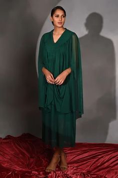 Shop for Jyoti Sachdev Iyer Green Lycra Cowl Draped Dress for Women Online at Aza Fashions Green Pleated Draped Dress, Pre-draped Dresses With Folds, Formal Dress With Traditional Draped Sleeves, Formal Dress With Draped Sleeves, Festive Dress With Draped Cape Sleeves, Festive Dresses With Draped Cape Sleeves, Draped Cocktail Dresses With Gathered Sleeves, Cocktail Dresses With Gathered Sleeves And Draped Style, Festive Green Draped Dresses