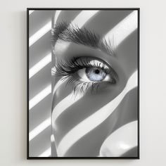 a black and white photo of an eye with long lashes on it's face