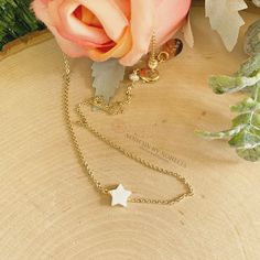 Tiny Mother of Pearl (Nacre) star necklace. The nacre has a high luster with white tones. Celestial jewelry is in at the moment. This is a lovely star necklace, it's a delight for the eyes! This dainty Mother of Pearl star, is made with a gold-plated chain. Perfect for everyday wear, this necklace looks great layered with other necklaces or by itself. When you put on a piece of jewelry, you probably focus on how it looks with your outfit or what it says about your style. Remember, in simplicity, White Star-shaped Clavicle Chain Necklace, Dainty Adjustable Star Charm Necklaces, Adjustable Star-shaped Necklace With Delicate Chain, Star Charm Choker Necklace For Gifts, Star Charm Choker Necklace As Gift, White Star-shaped Jewelry With Adjustable Chain, Dainty Star Charm Choker Necklace, Star-shaped Clavicle Chain Choker Gift, Dainty Choker Necklace With Star Charm