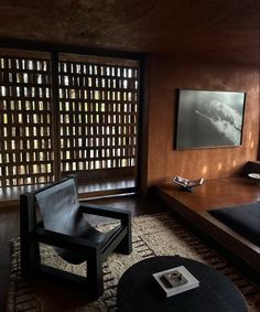 a living room filled with furniture and a flat screen tv mounted to the side of a wall