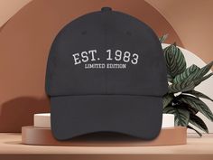 "Elevate your hat game with our 1993 embroidered dad hat, a perfect blend of style and nostalgia. ✨DESCRIPTION✨  🌟GILDAN 18000 Unisex Sweatshirt - Embroidered design * Adjustable strap with antique buckle * One size fits all * 100% chino cotton twill * Green Camo color is 35% chino cotton twill, 65% polyester * Unstructured, 6-panel, curved visor * 6 embroidered eyelets * 3 ⅛\" (7.6 cm) crown 📣Looking for more embroidered hats or this design on a sweatshirt? Check out the range in store! 👉 https://www.etsy.com/au/shop/FineThreadCollective ✨SHIPPING AND PROCESSING✨ ✏Please allow 4-6 business days for your order to be processed. Your item is custom made! ✈Your order ships from the US. Allow 6-9 business days shipping for US orders. Unfortunately, I am unable to guarantee USPS shipping tim Black Cap With Custom Embroidery, Black Six-panel Snapback Hat With Embroidered Logo, Black Embroidered Logo 5-panel Trucker Hat, Black Embroidered Logo Six-panel Snapback Hat, Black 5-panel Baseball Cap With Embroidered Logo, 60th Birthday Gifts, Camo Colors, Birthday Hat, 40th Birthday Gifts