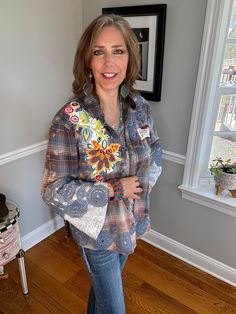 a woman standing in a room with her hands on her hips