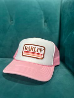 The Darlin' Trucker is a playful pink trucker hat with a Darlin' patch, perfect for cowboyin' at the rodeo. Stay cool and stylish with this quirky hat that is sure to turn heads. Pink Trucker Hat, Big Country, Country Western, Stay Cool, Western Wear, Rodeo, Trucker Hat, Turn Ons, Hats