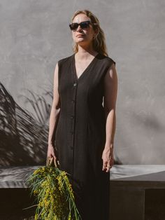 This little black dress has that beautiful, classic French feeling; the silhouette is easy and flattering with unique fabric texture, elegant front buttons and a tie to adjust the shape at the back. Wear this as a one-and-done look and let your shoes change the look each time, reminding you that each day is a gift! End Of Spring, Unique Fabric, June 2024, Your Shoes, Fabric Texture, Fall Collections, Each Day, Jumpsuit Dress, Best Sellers