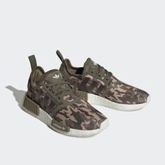 Camouflage Nmd Shoes Made In Part With Parley Ocean Plastic. The Great Thing About Camo Is That You Can Use It To Blend In Or Stand Out. You Make The Call In These Adidas Nmd Shoes With A Camo-Print Upper. Built With Energy-Returning Boost And A Mesh Upper That Hugs The Foot, These Sneakers Are Made For All-Day Comfort. They're Finished With The Signature Nmd Midsole Plugs Just To Make Sure The Adidas Dna Is Obvious. This Shoe's Upper Is Made With A High-Performance Yarn Which Contains At Least Adidas Sam Smith, Adidas Dna, Adidas Zx 700, Adidas Shoes Nmd, Casual Tennis Shoes, Adidas Originals Nmd R1, Adidas Continental 80, Toddler Adidas, Adidas Continental