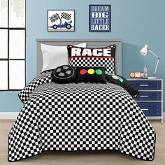 a black and white checkered comforter set with a video game controller on it