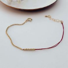 PRANA LINKS GOOD LUCK BRACELET – Victoria Bekerman Studio Threaded Bracelets, Pen Skills, Stacked Bracelets, Good Luck Bracelet, Thread Bracelets, Small Kids, Chic Bracelet, Red Thread, Luck Charm