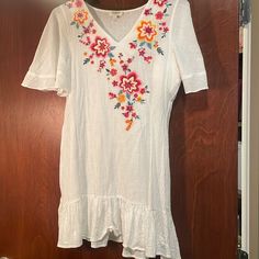 Adorable Boho V Neck Dress With Embroidered Flowers. Cute Dress Or Swim Coverup. Never Worn. White V-neck Dress With Floral Embroidery, Casual Multicolor Embroidered V-neck Dress, White Floral Applique Dress For Summer, Casual Embroidered V-neck Dress For Brunch, Casual V-neck Embroidered Dress For Brunch, Casual Summer Dress With Floral Applique, Short Sleeve Embroidered Dress For Brunch, Casual White Embroidered Dress, White Floral Embroidered Summer Dress