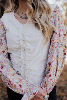 Look far from ordinary in The Pearl! This ivory blouse features a beautiful floral print and long puff sleeves with elastic cuffs and delicate ruffles. A ruffle trim runs down the center, adding a touch of whimsical charm to your fall wardrobe. Get ready for some Oohs and Ahhs! Mallory is wearing size small Pearl Blouse, Ivory Blouse, Curvy Dress, Heritage Collection, Long Puff Sleeves, The Pearl, Fall Wardrobe, Ruffle Trim, Puff Sleeves