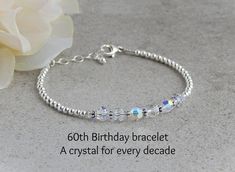 "This 60th Birthday bracelet is makes a great Birthday gift for her!  It is made with 6 Preciosa round crystals one for every decade and sterling silver round beads. It has lots of sparkle! This bracelet measures about 7\" and has a very sturdy 1\" extension chain giving you up to 8\" if needed.  It is finished with a nice sized lobster clasp and a round sterling silver bead hanging from the extension chain.  If you need another size please let me know and I can customize one for you. ~PACKAGING Adjustable Crystal Bracelet For Anniversary On Mother's Day, Personalized Silver Crystal Bracelet For Anniversary, Elegant Crystal Bracelet With Birthstone For Anniversary, Elegant Crystal Bracelet For Birthday, Elegant Birthstone Crystal Bracelet For Anniversary, Elegant Crystal Birthstone Bracelet For Anniversary, Adjustable Silver Crystal Bracelet For Birthday, Silver Crystal Bracelet For Birthday And Mother's Day, Silver Crystal Birthstone Bracelet For Birthday