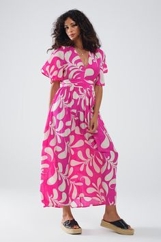 Introducing our Fuchsia Floral Print Maxi Dress with Open Back, the quintessential summer staple designed to combine comfort and style effortlessly. This lovely maxi dress features a vibrant floral print in a striking fuchsia hue, making it a standout piece for any warm-weather occasion. The angel sleeves add a touch of elegance, while the sexy open back provides a captivating and airy feel.  Crafted from 100% Polyester, this dress offers a lightweight and breathable wear, perfect for staying cool during the hottest days. The V-neck neckline enhances its flattering silhouette, and the elastic waist ensures a comfortable fit that accentuates your figure. The full-length design adds a touch of sophistication, making it suitable for both casual outings and more dressy occasions.  Our model, s Dress With Floral Print, Angel Sleeves, Dress With Open Back, Summer Maxi, Floral Print Maxi Dress, Floral Print Maxi, Summer Maxi Dress, Estilo Casual, Printed Maxi Dress