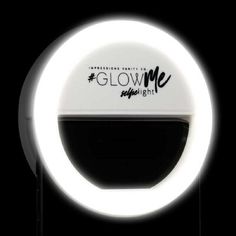 an illuminated sign with the words glow me in black and white letters on it's side