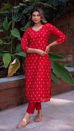 Bring on the festive spirit with our kurta set in hand embroidered chanderi silk. Fully lined kurta and pants. Made in chanderi silk. Dupatta in mul cotton with gold tikki details. Color of Kurta + Pants : Red. Color of Dupatta : Purple. Model height is 5.6” and is wearing a size S. Wash Care : Dry Clean Only. Chanderi Kurta With Resham Embroidery For Navratri, Diwali Straight Kurta Palazzo Set With Gota Work, Diwali Palazzo Set With Gota Work On Straight Kurta, Navratri Palazzo Set With Straight Kurta And Gota Work, Mulmul Palazzo Set With Zari Work And Straight Kurta, Chanderi Kurta With Resham Embroidery For Diwali, Navratri Festive Palazzo Set With Chikankari Embroidery, Festive Resham Embroidered Mulmul Palazzo Set, Festive Sets With Resham Embroidery And Straight Kurta