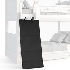 a bunk bed with a black bag hanging from it's side