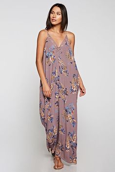 Are You Summer Ready? A beautiful and versatile sleeveless maxi dress in a floral print. Featuring adjustable spaghetti straps, an oversize cocoon fit, an embroidered trim v neckline, and side pockets. Great Resort Wear! Stay Sexy! Fabric: 100% Rayon Flowy Casual Maxi Dress With Floral Embroidery, Casual V-neck Maxi Dress With Floral Embroidery, Casual Floral Embroidered Maxi Dress For Beach, Floral Embroidered V-neck Maxi Dress For Brunch, Floral Print V-neck Maxi Dress For Loungewear, Summer Floral Print Maxi Dress For Loungewear, Summer Floral Embroidered V-neck Maxi Dress, Casual Maxi Dress With Spaghetti Straps For Loungewear, Casual Spaghetti Strap Maxi Dress For Loungewear