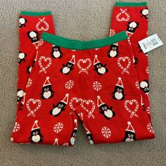 Christmas Sweater Leggings Penguins And Candy Canes Nwt Size Medium Material Has Stretch. Casual Red Holiday Bottoms, Casual Red Bottoms For Holidays, Winter Holiday Cotton Bottoms, Red Casual Leggings For Winter, Red Casual Winter Leggings, Casual Pants For Winter Holiday, Cute Red Stretch Bottoms, Cute Stretch Red Bottoms, Red Festive Bottoms For Winter