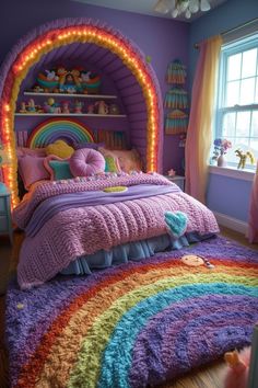 a bedroom decorated in purple and rainbow colors