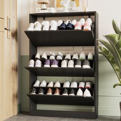 there are many pairs of shoes on the shelf next to each other in this room