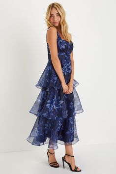 Everyone will be wowed when you walk in wearing the Lulus Dramatic Glamour Navy Blue Floral Organza Tiered Midi Dress! Airy woven organza boasts a moody floral print as it shapes wide tank straps and a square neckline. Banded waist boasts chic gathered details, atop a voluminous tiered skirt that falls to a long midi hem. Hidden zipper/clasp at side. Fit: This garment runs small - please size up. Length: Mid-calf length. Size medium measures 50.5" from shoulder to hem. Bust: Works best for A to Organza Prom Dress With Floral Print, Organza Floral Print Prom Dresses, Floral Print Organza Prom Dress, Floral Print Organza Dresses For Prom, Formal Floral Organza Dress, Formal Floral Print Organza Dress, Sleeveless Floral Print Organza Dress, Blue Organza Dress For Wedding Guest, Party Organza Midi Dress With Floral Print