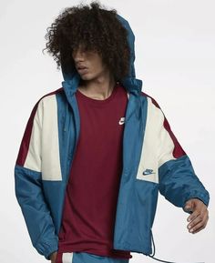 This Nike Sportswear 1989 Retro Windbreaker Jacket is the perfect addition to any wardrobe. Made with polyester fabric and a mesh lining, it is perfect for summer, fall, and spring. The jacket features a stand-up collar, long sleeves, and a mid-length coat style. It has a colorblock pattern of blue, red, and sail, giving it a unique look. This limited edition Nike jacket is perfect for athleisure and activewear occasions. It has a relaxed fit and elastic waist for added comfort. It also has inner pockets, removable hood, and pockets for storing your essentials. This jacket is part of the Nike 89 Jacket product line and is a must-have for any fan of Kith, Concepts, Air Max, Windbreaker, 80s, Retro, and Dunk themes. Nike Casual Long Sleeve Sport Coat, Casual Nike Sport Coat With Long Sleeves, Nike Urban Long Sleeve Track Jacket, Nike Urban Style Long Sleeve Track Jacket, Nike Long Sleeve Sport Coat For Outdoor, Urban Nike Long Sleeve Track Jacket, Nike Fall Windbreaker For Streetwear, Nike Long Sleeve Hooded Jacket For Streetwear, Retro Long Sleeve Track Jacket For Winter